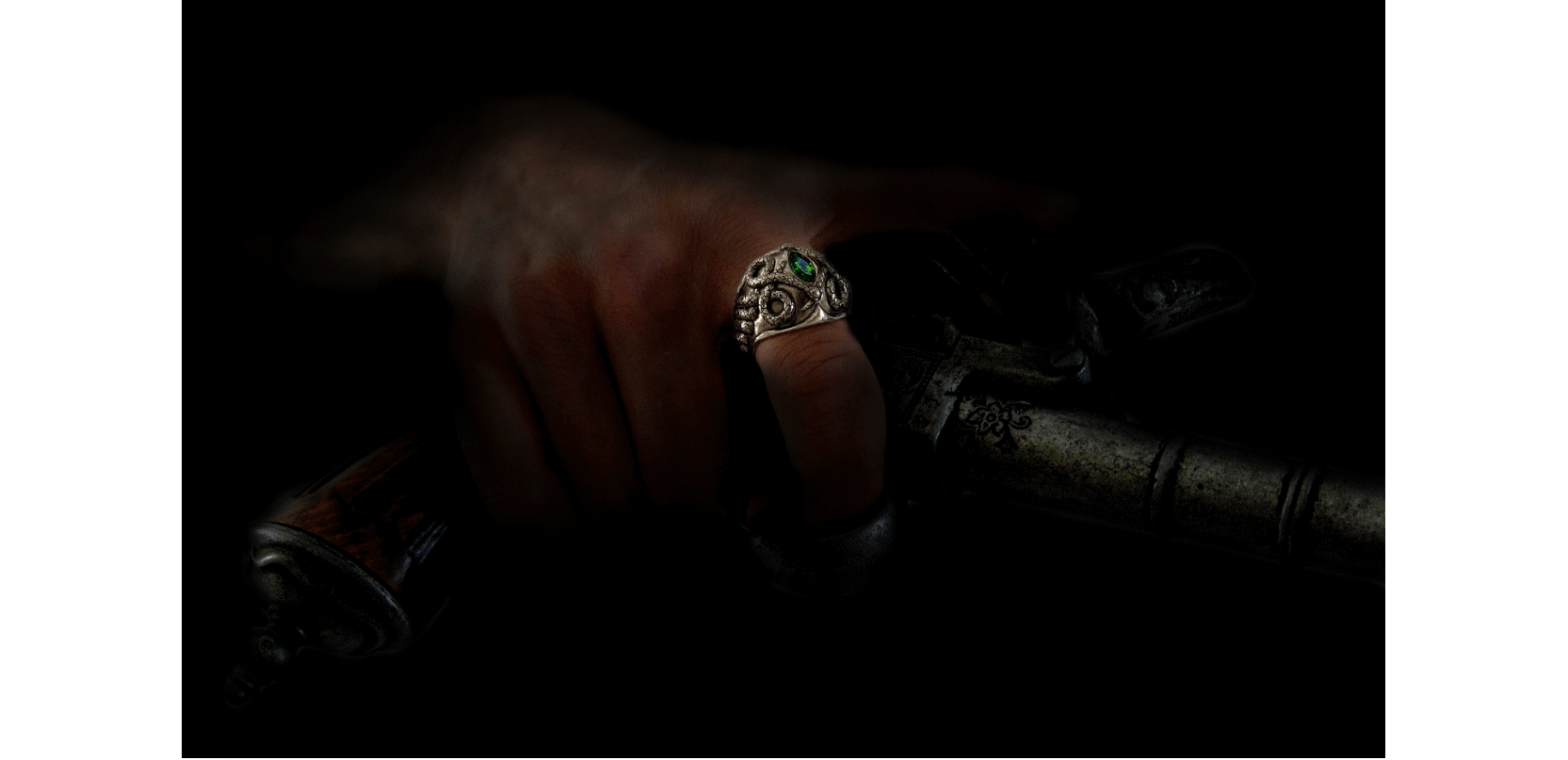 bague serpents entrelacés en bronze blanc avec pierre verte